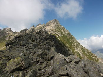 Low angle view of rock formation against sky