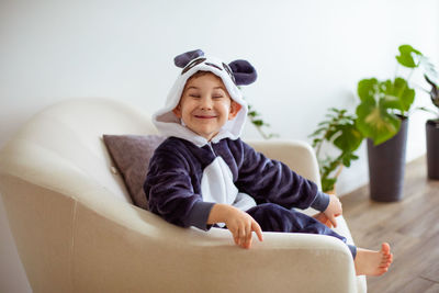 Portrait of smiling boy sitting