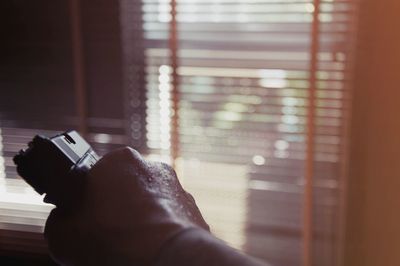 Low section of woman using mobile phone