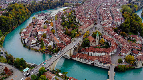 High angle view of bridge over river amidst buildings