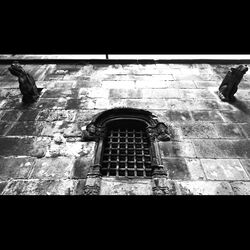 Man standing against built structure