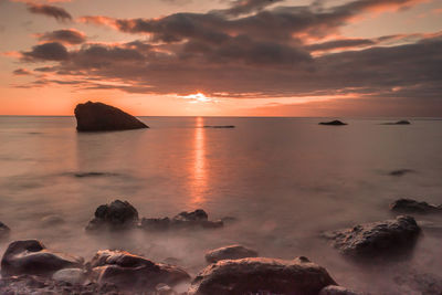 Scenic view of sea at sunset