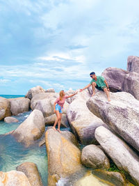 Couple on big rocks belitung island