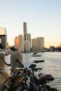 Bicycle on city against sky