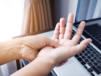 Close-up of hand using mobile phone