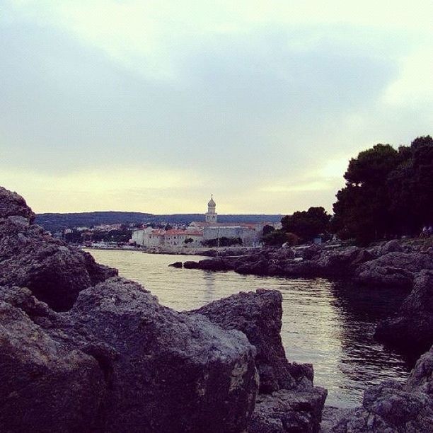 water, rock - object, sky, sea, built structure, scenics, tranquility, architecture, tranquil scene, nature, beauty in nature, cloud - sky, rock formation, rock, shore, horizon over water, building exterior, stone - object, beach, outdoors