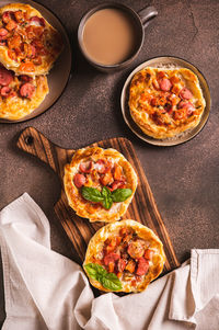 Chicago pizza pot pie with tomatoes, cheese and sausage on a wooden board top and vertical view