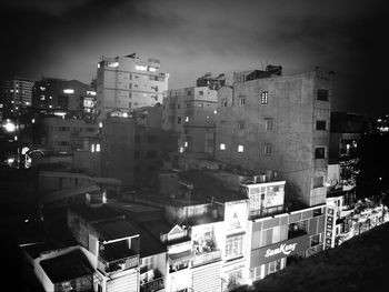 High angle view of illuminated buildings in city at night