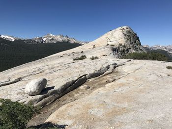 Scenic view of rocky mountains against clear blue sky