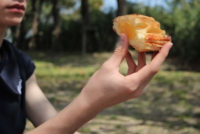 Midsection of woman holding food