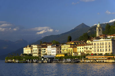 Calm lake with built structures on landscape