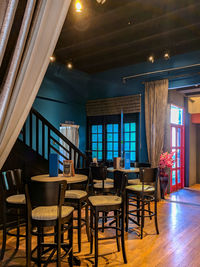 Empty chairs and tables in restaurant