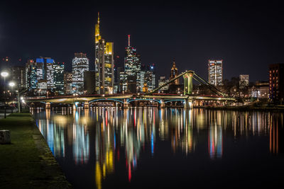 Illuminated city at waterfront