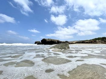 Scenic view of beach against sky