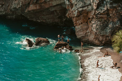 People swimming in sea