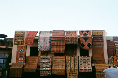 Stack of multi colored built structure against clear sky