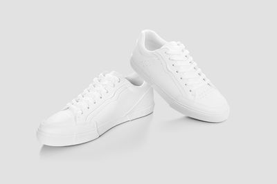 Close-up of shoes against white background