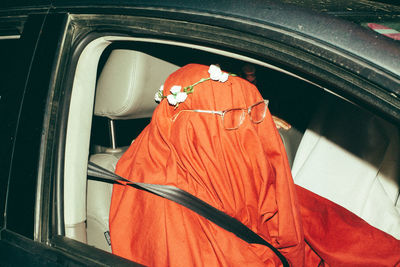 High angle view of orange car on window