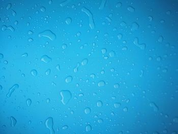 Full frame shot of wet glass window