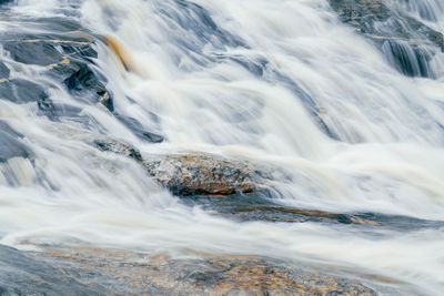 Beautiful waterfall in lush tropical forest, chiang mai, thailand. nature landscape. long exposure