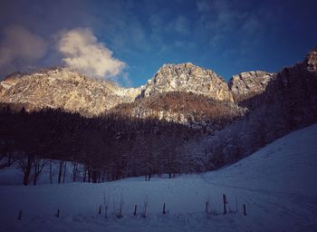 Scenic view of snowcapped mountains against sky