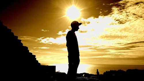 Silhouette of man at sunset