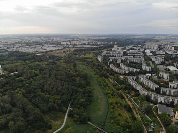 High angle view of buildings in city against sky