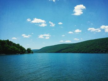 Scenic view of lake against cloudy sky