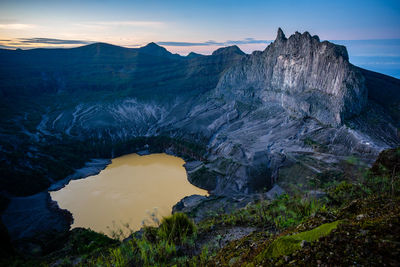 Scenic view of mountains against sky during sunset