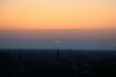 Cityscape against sky during sunset