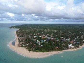 Scenic view of sea against sky in city