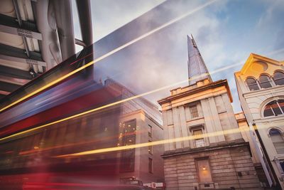 Reflection of buildings on running bus