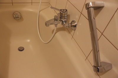 High angle view of faucet in bathroom