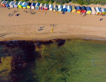 Aerial view of colorful huts at beach