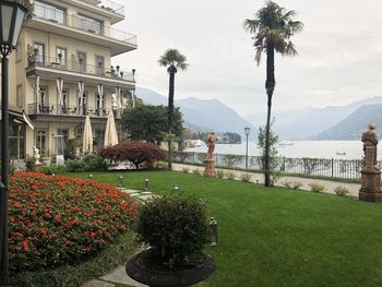 Scenic view of lake by building against sky