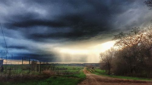 Scenic view of dramatic sky over landscape