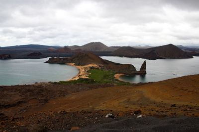 Scenic view of mountains against cloudy sky