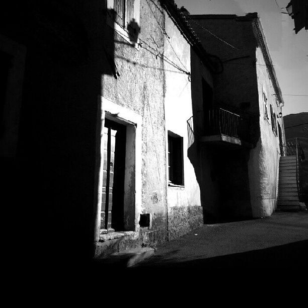 architecture, building exterior, built structure, window, house, residential structure, residential building, building, sunlight, shadow, no people, day, abandoned, outdoors, city, door, low angle view, old, exterior, wall