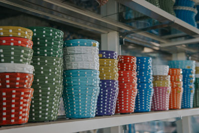 Multi colored baskets for sale at market stall