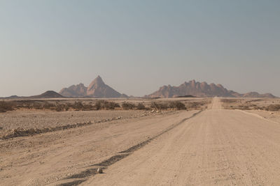 Scenic view of desert against clear sky
