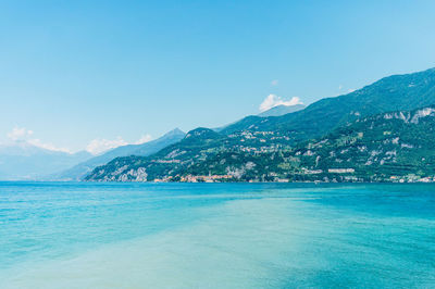 Como lake against distant city on shore