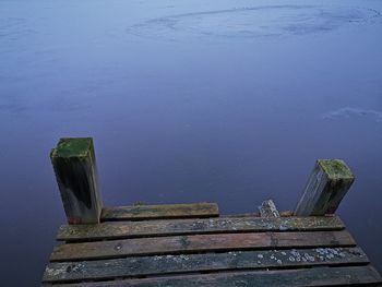 High angle view of old wooden pier over lake