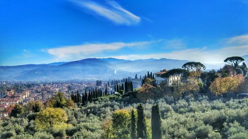 Scenic view of mountains against cloudy sky