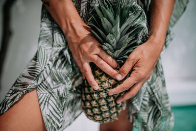 Midsection of couple holding hands