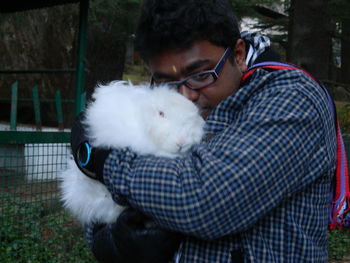 Close-up of man with dog