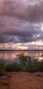 Scenic view of sea against storm clouds