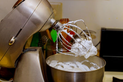 Close-up of pouring coffee in water