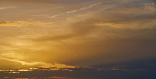 Low angle view of dramatic sky during sunset