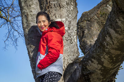 Portrait of smiling young woman in winter