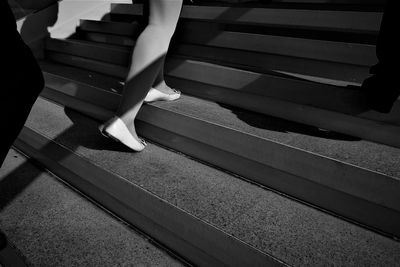 Low section of woman on steps